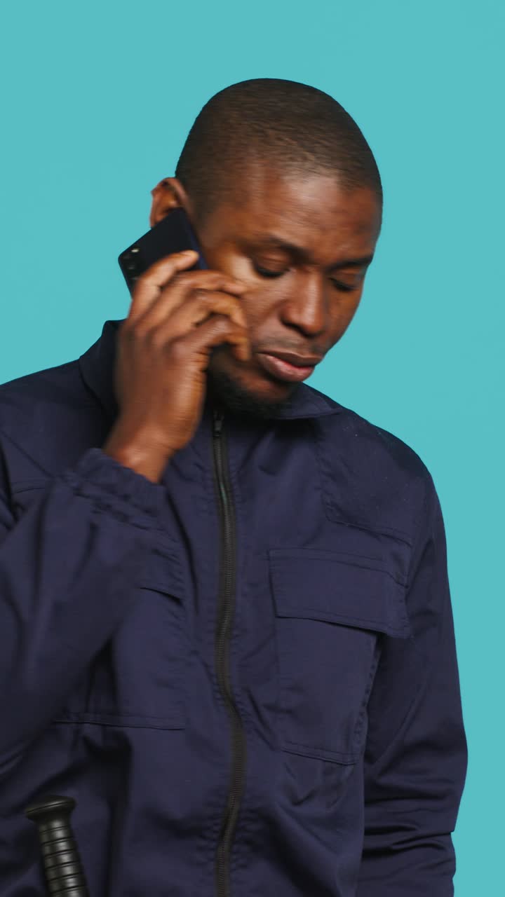 African American Man Talking on Smartphone in Studio