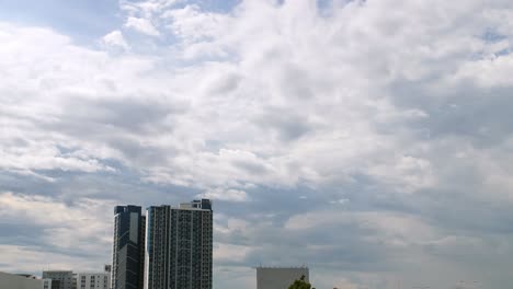Condominium-and-house-in-front-of-sky-cloud-moving-and-natural-daylight