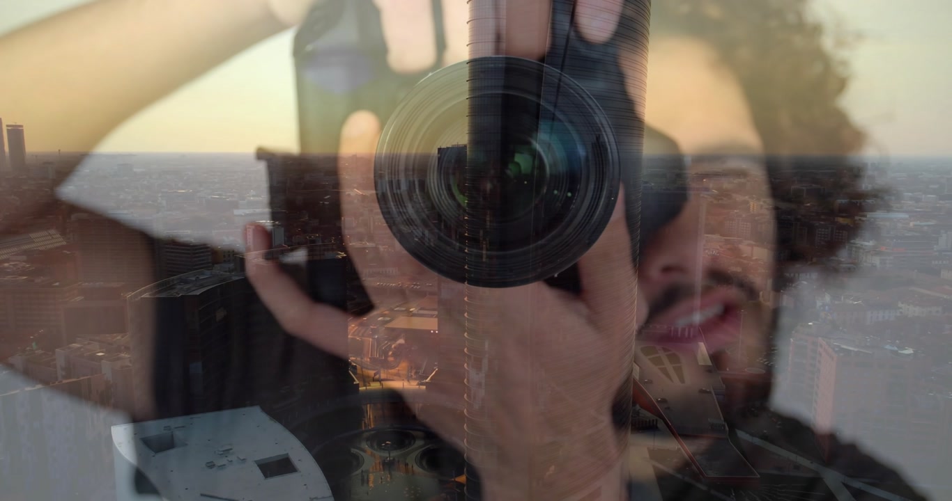 Photographer raising DSLR camera against sunset window glass, capturing city skyline reflections