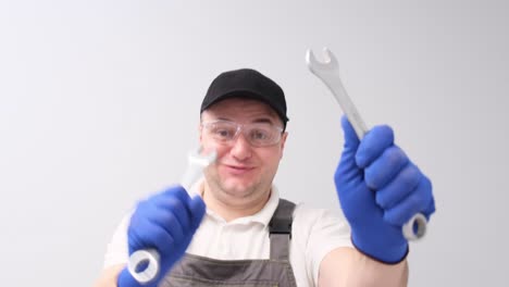 Construction worker holding wrenches