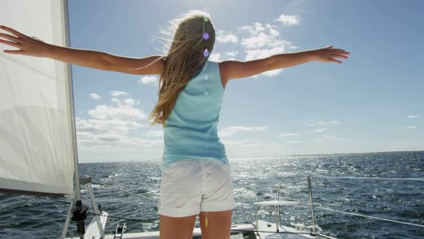 young blonde female enjoying vacation on luxury yacht