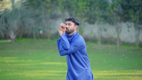 Indian-man-doing-Eagle-yoga-pose