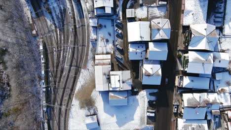 Looking-Down-At-Cars-Driving-In-Village-|-Lauterbrunnen-Switzerland,-Swiss-Valley-in-Alps-Drone,-Europe,-4K