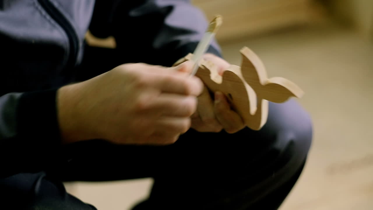 Giving Perfect Smoothness. Carpenter using electric sander. Carpenter sanding a wood with sander