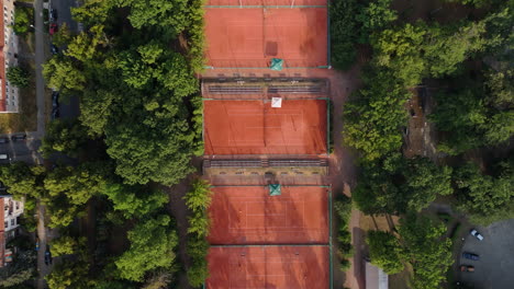 aerial view of tennis courts in a city park