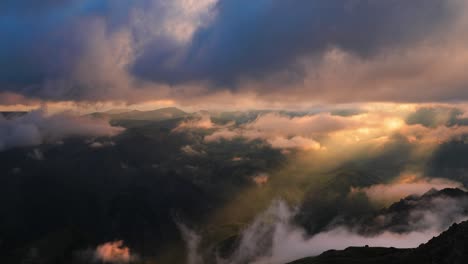 low clouds over a highland plateau in the rays of sunset. sunset on bermamyt plateau north caucasus, karachay-cherkessia, russia.