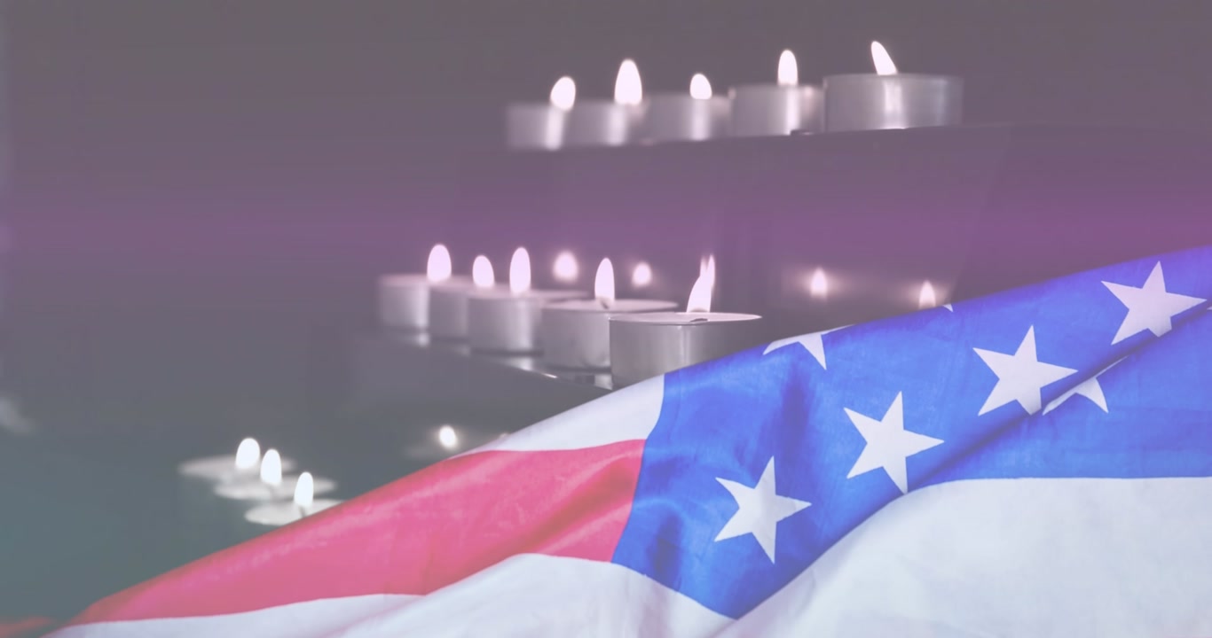 Animation of light trails over candles and flag of usa