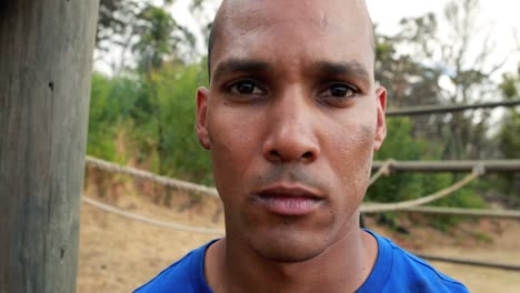 portrait of fit man during obstacle course