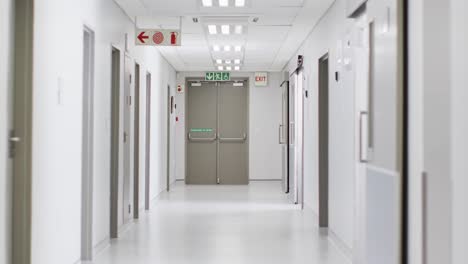 video of brightly lit, clean, empty corridor in modern hospital, with copy space