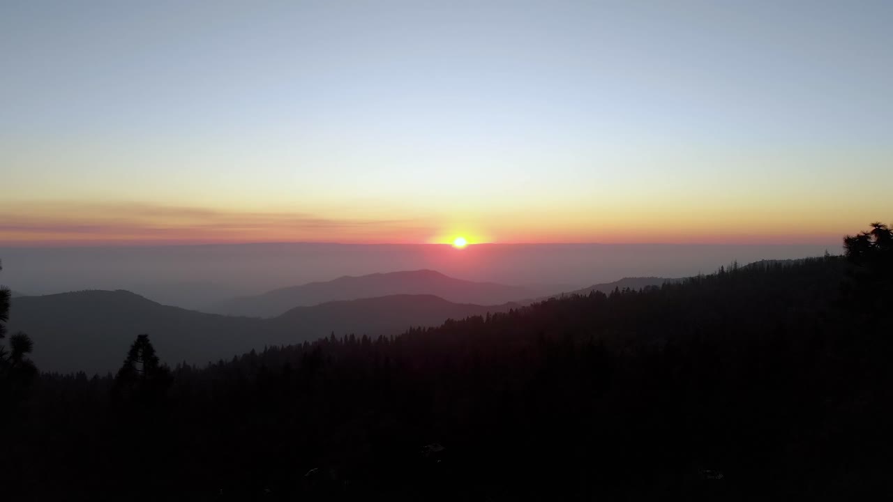The last few seconds before the sun dips behind the Sierra Nevada Mountains near Shaver Lake, CA.