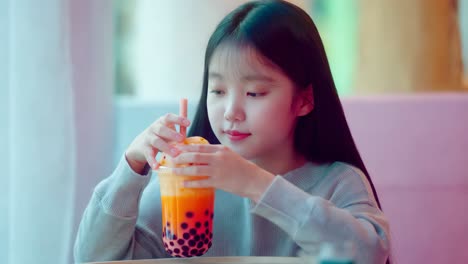 young girl enjoying bubble tea