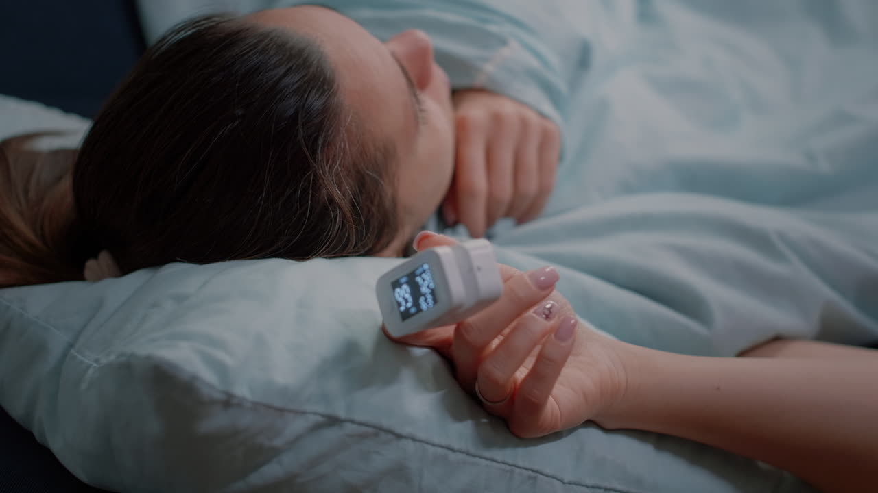 Portrait of african american architect looking at blueprints plans to work on building model