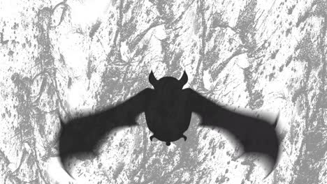 Digitale-Animation-Der-Silhouette-Eines-Fliegenden-Fledermaus-Symbols-Vor-Grunge-Textur-Auf-Grauem-Hintergrund