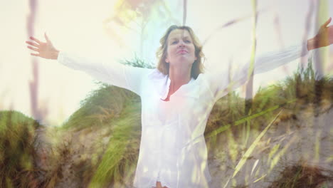 animation of caucasian woman with arms outstretched on beach