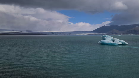 iceberg in cold glacial water under glacier, iceland