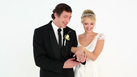 newlyweds admiring their wedding rings