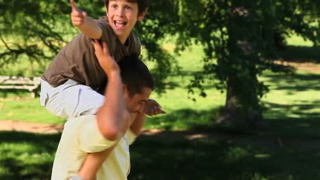 Father-carrying-son-and-enjoying-the-time-together