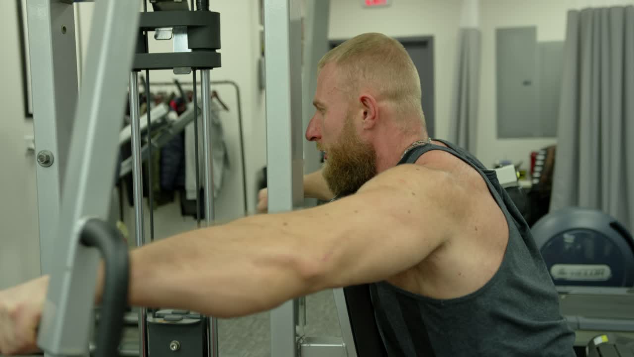 Strong bodybuilder strength workout in sport club