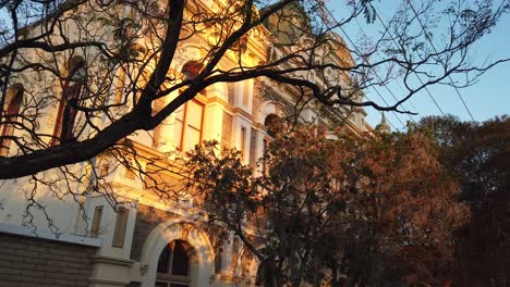 Passing-through-the-trees-to-reveal-Trades-Hall