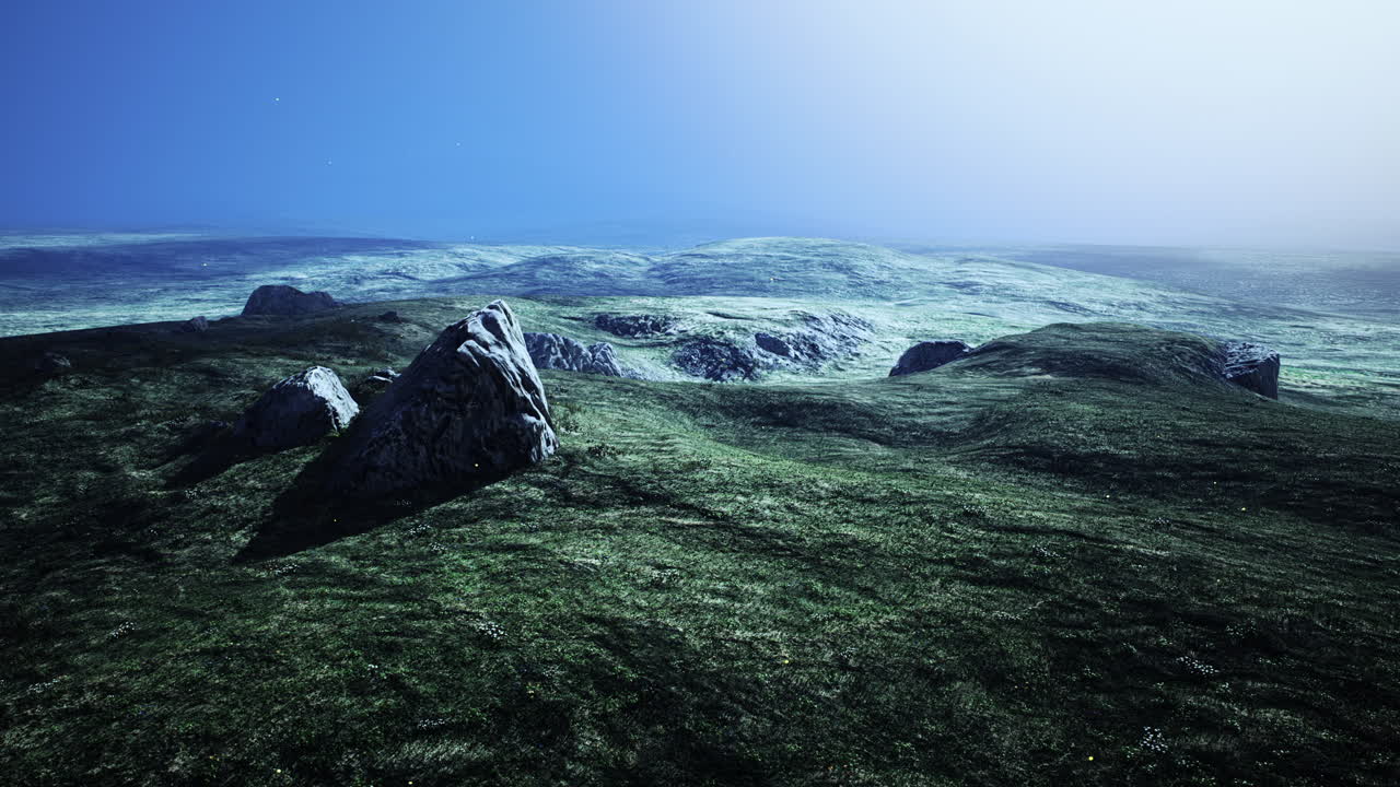 큰 모래 돌과 녹색 잔디 언덕 배경