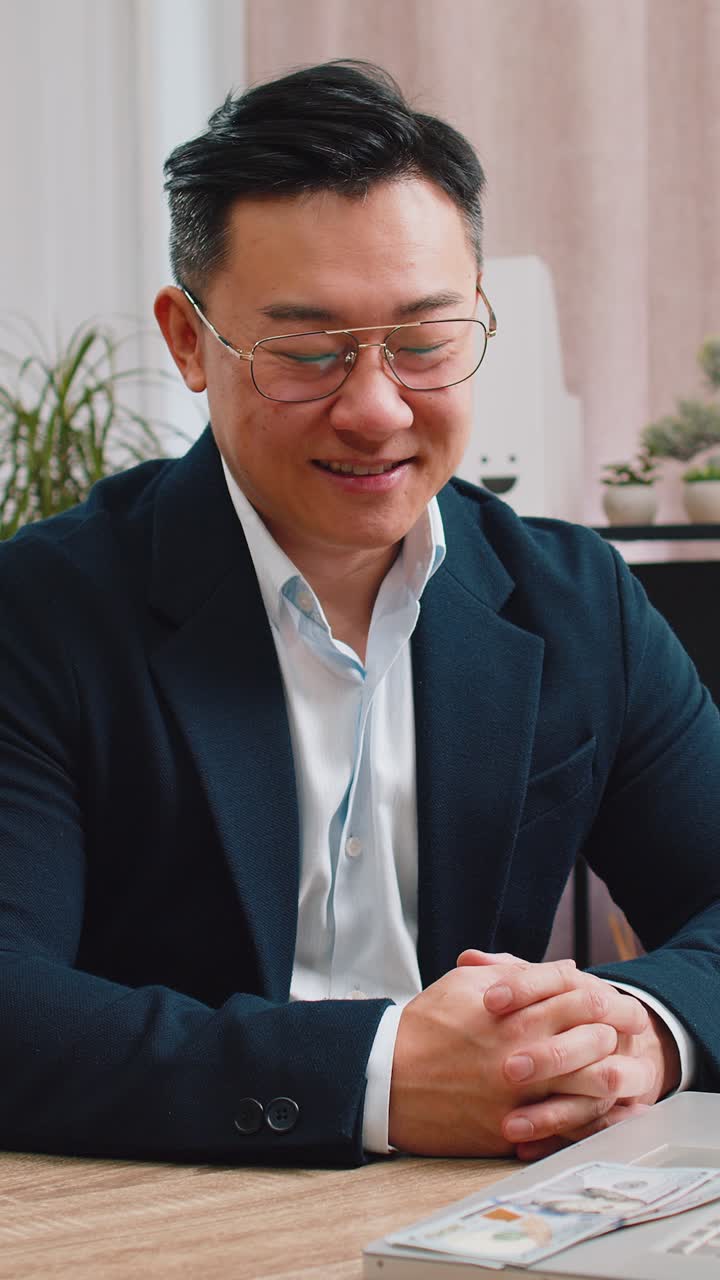 Rich businessman in suit working on laptop pc counting money cash calculate earnings income profit