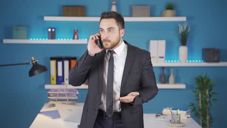 businessman getting angry on phone call.