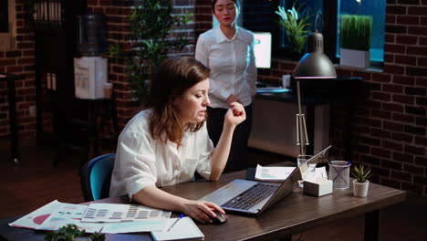 employee asking for help from coworker after being stuck on project task