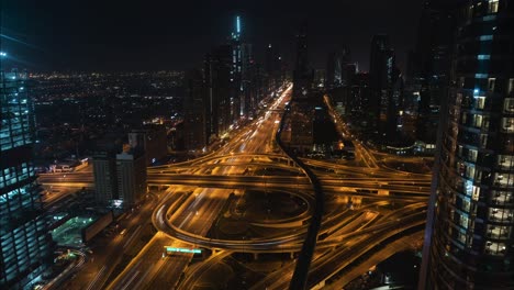 night to day timelapse: a huge highway in dubai lighting up