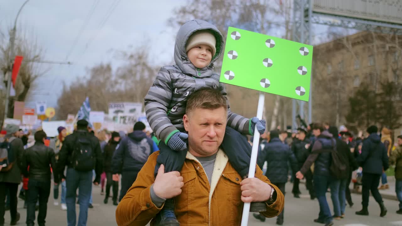 Dad and kid at political rally for animal right. Stop future generation violence