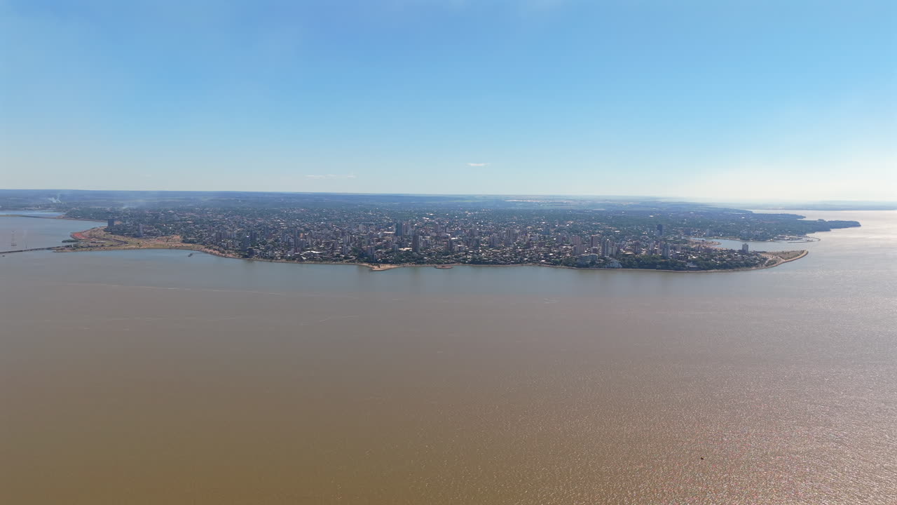 Distant panoramic shot of the city of Posadas on a clear sunny day.