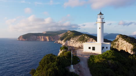 a lighthouse on the tip of the lefkada peninsula and the cliffs behind it