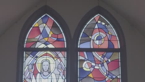 camera panning along a church window, depicting the resurrection of christ