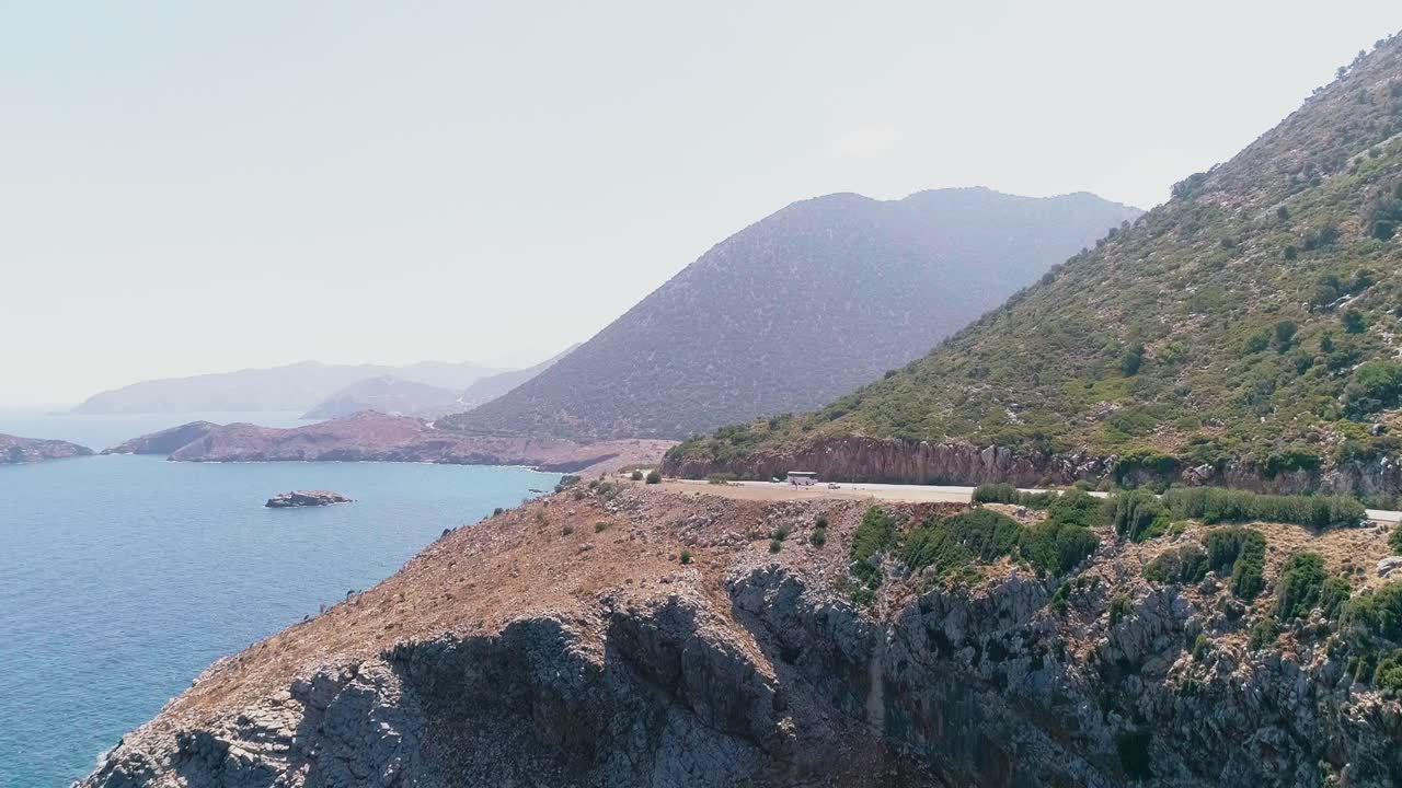 A shot from a drone of a road on the coast of the Greek island of Crete