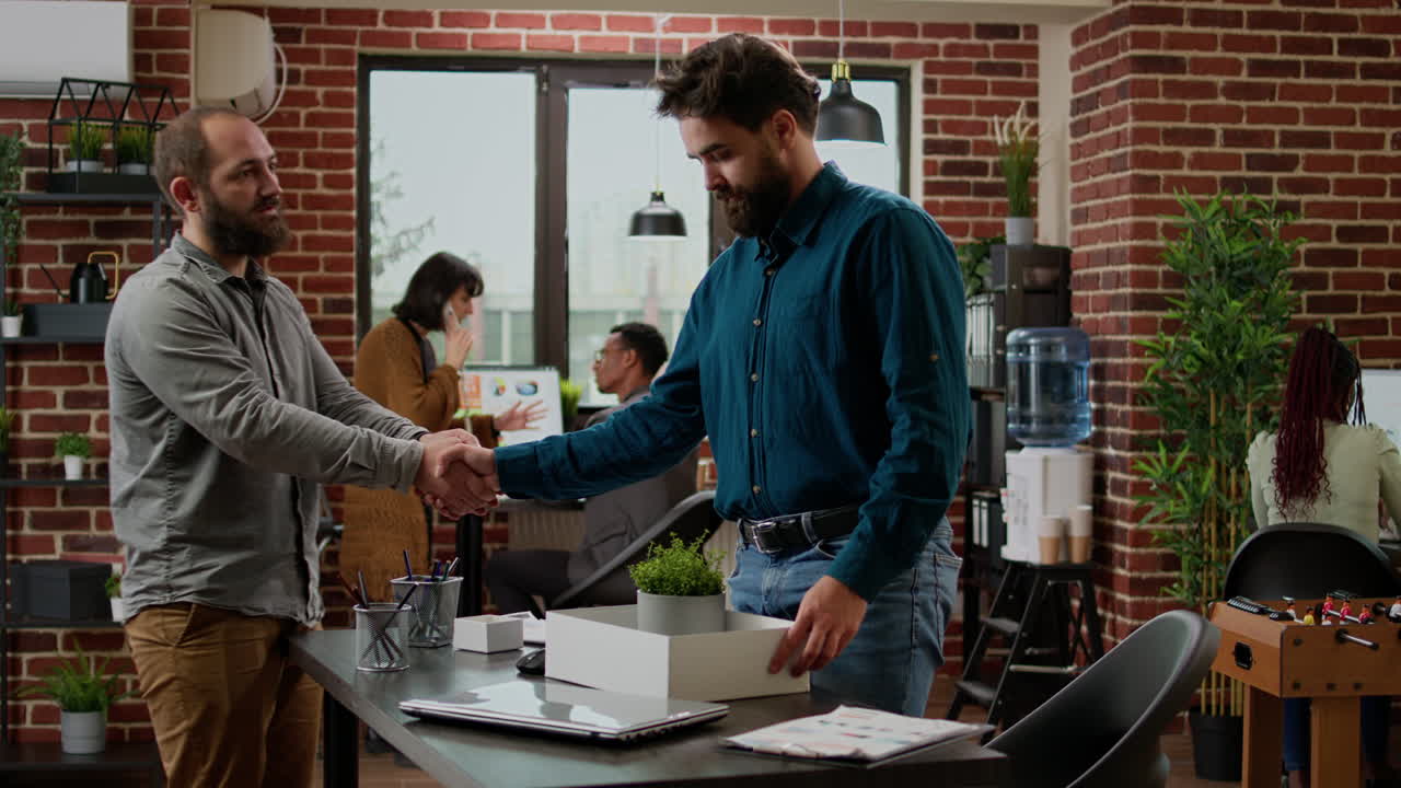 Distraught worried man packing office belongings after getting fired