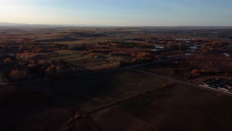 red and orange trees during sunset in the canadian prairies