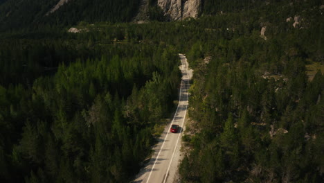 red car on a mountain road
