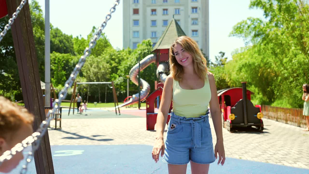 Woman and child playing in a park