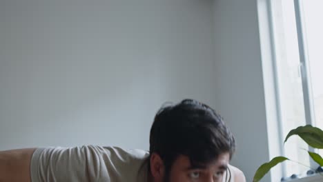 man doing a plank exercise at home