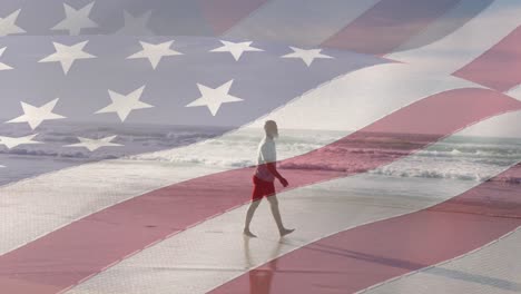 Animation-of-flag-of-united-states-of-america-over-senior-african-american-man-on-beach