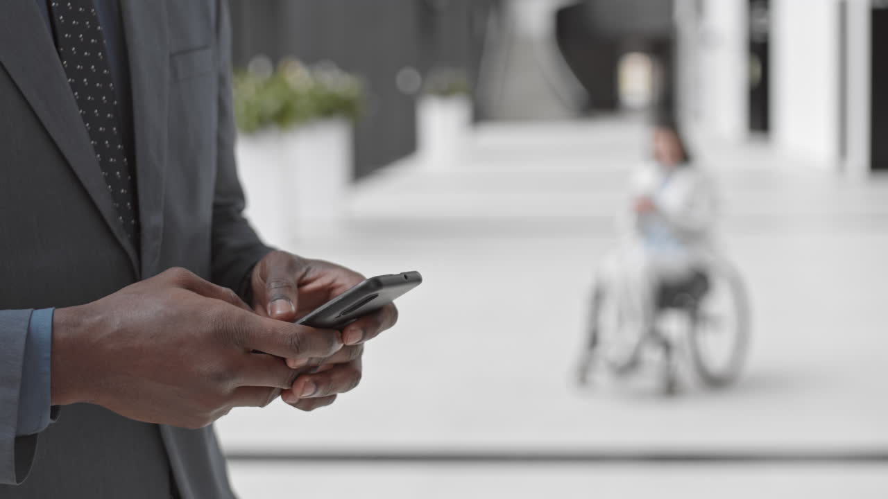 Unrecognizable African American Businessman Using Smartphone