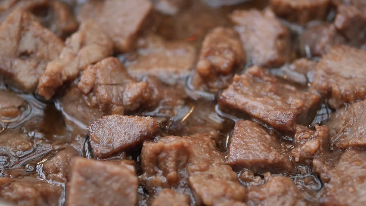 Cubed Meat Frying in Pan