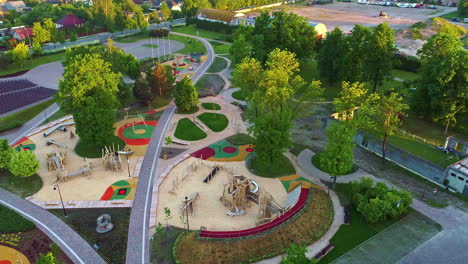 Aerial-View-Of-Uzvaras-Parks-With-Playground-And-Green-Trees-In-Jelgava,-Latvia