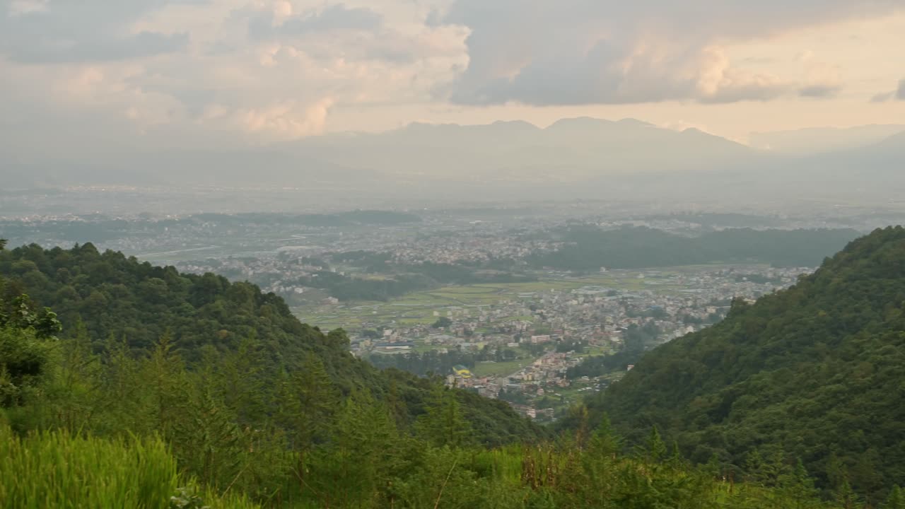 Pady Fields and Kathmandu City Sunset, Rural Landscape Scenery in Nepal with Rice Fields Paddies and Paddy Fields Terraces in a Rural Village in Kathmandu Valley with the City Behind