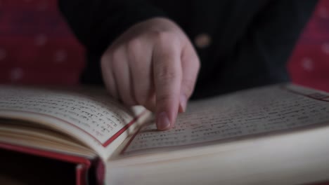 hand on quran pages