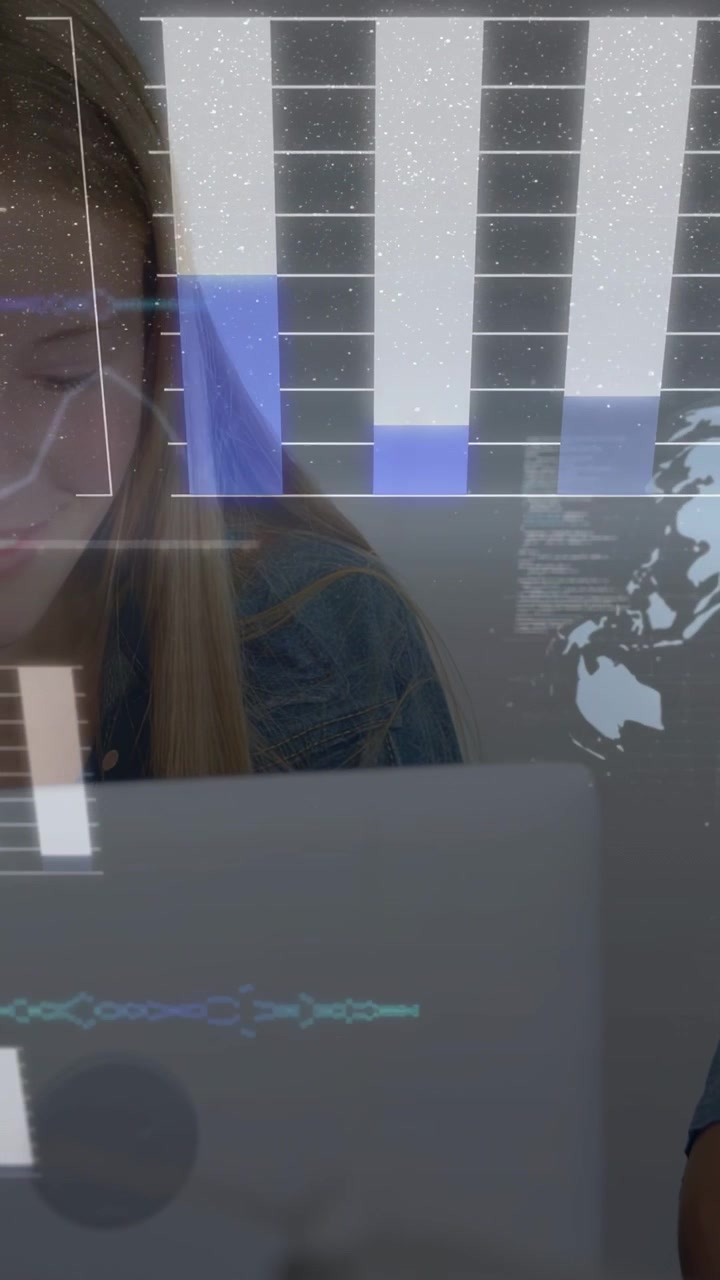 Vertical video: Students typing, causing HUD bars to fill and globe to spin for education project