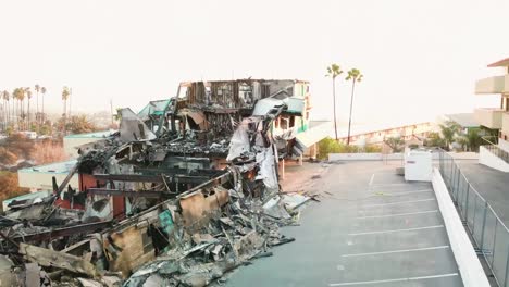 Aerial-over-a-hillside-apartment-building-destroyed-by-fire-in-Ventura-California-following-the-Thomas-wildfire-in-2017