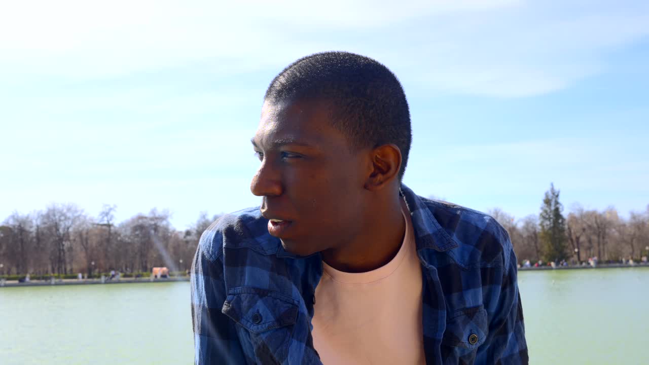 Portrait of a Smiling Man by a Lake