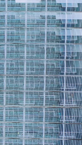 large glass greenhouse. aerial view farming vegetable cultivation agriculture industry. transparent glass roof for vegetables. vertical video