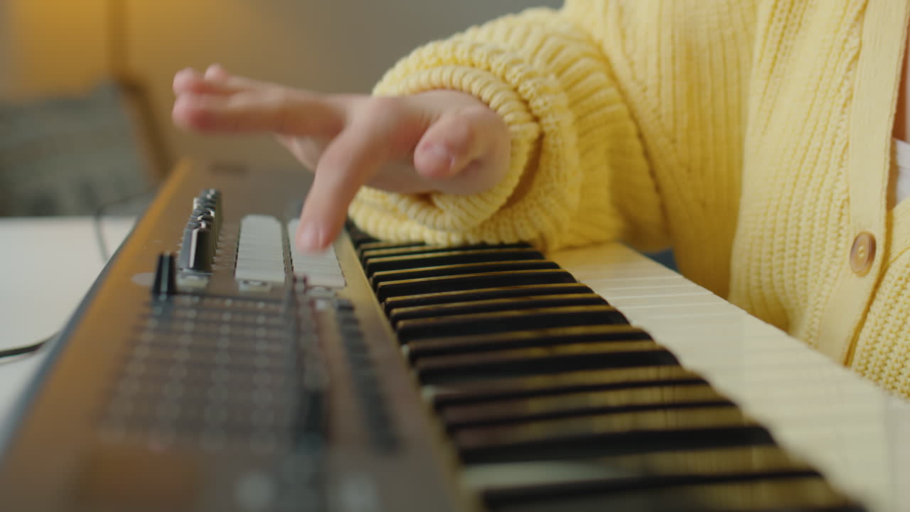 Girl with Down Syndrome Learning How to Play Synth