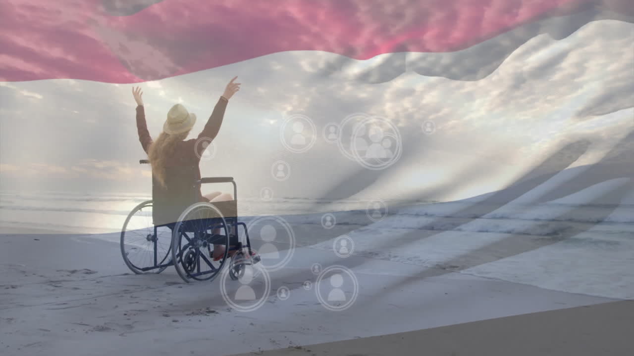 Person in wheelchair celebrating on beach with digital connections animation overlay